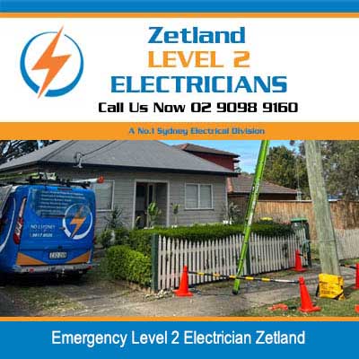 Emergency level 2 electrician in a residential house and white picket fence with safety cones in Zetland